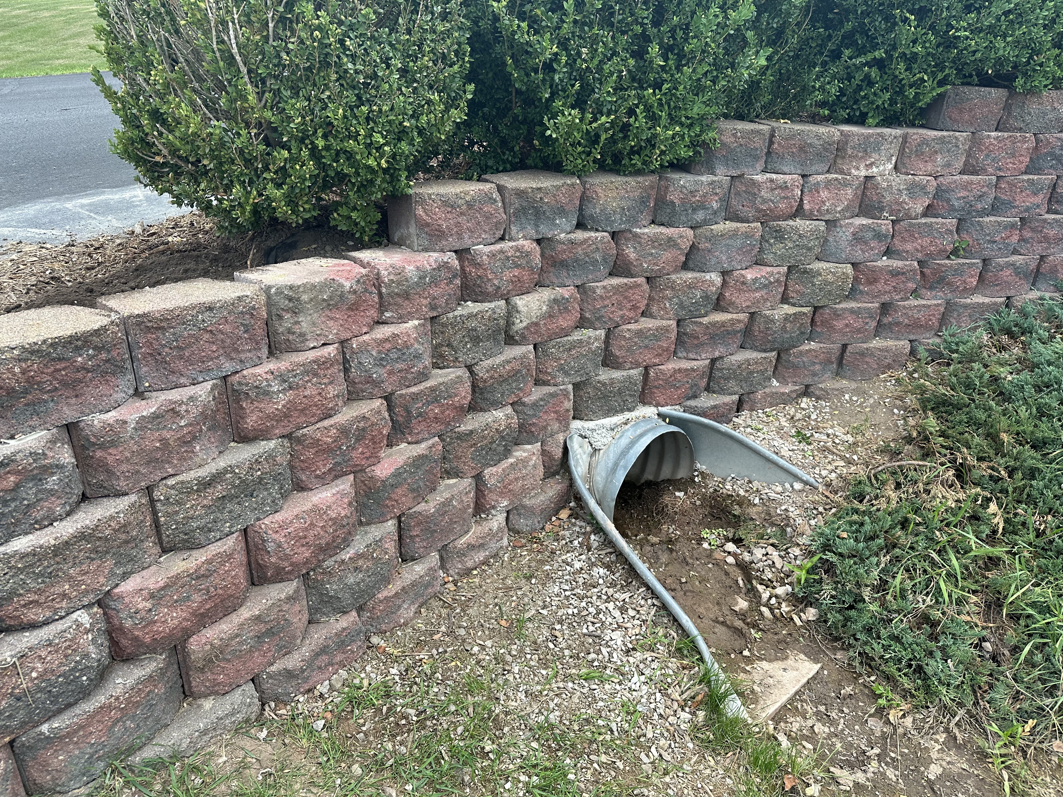 Retaining wall installation in a sloped yard